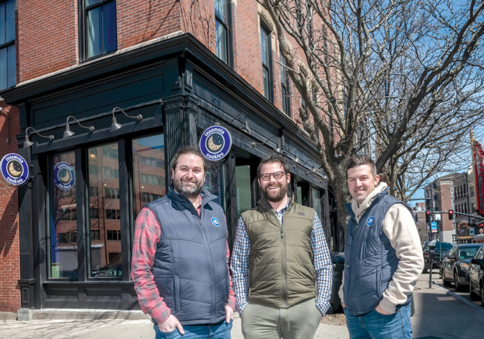 NEW DIGS: Providence Living is emerging as a real estate developer behind some of the most prominent redevelopment projects in the city. In front of their newly rehabilitated downtown headquarters at 259 Weybosset St., are, from left, Dustin Dezube, owner; Kevin Diamond, principal architect of Providence Architecture; and Eric Belisle, principal of Providence Building. / PBN PHOTO/MICHAEL SALERNO