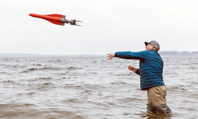 LIFTOFF: Jaia Robotics LLC owner Ian Estaphan Owen launches one of his company’s aquatic robots in Narragansett Bay. Newport-based Jaia could be a benefactor if the University of Rhode Island Research Foundation’s proposal to boost the blue economy is named a winner in the $1 billion Build Back Better Regional Challenge. / PBN PHOTO/RUPERT WHITELEY