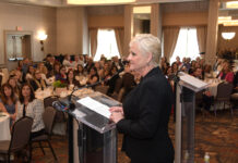 Merchant, Hughes among 30 top businesswomen honored by PBN CHERYL MERCHANT, CEO of Taco Comfort Solutions, delivers her acceptance speech after receiving the 2022 Career Achiever award in the Providence Business News' 2022 Business Women Awards program. / PBN PHOTO/MIKE SKORSKI