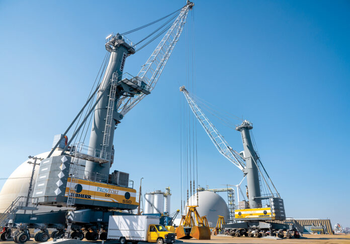 GOOD BUSINESS: Term-limited Providence Mayor Jorge O. Elorza says ProvPort Inc. has “thrived” during his eight years in office and should not be lumped in with perceived polluters on the city’s working waterfront. Above are two large cranes used to move material at the port. / PBN PHOTO/ MICHAEL SALERNO