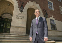 TEST CRITIC: Eric J. Mitnick, dean of the University of Massachusetts School of Law in Dartmouth, stands outside the Licht Judicial Complex in Providence. Mitnick is among the legal observers who believe the bar exam should be changed to better test the skills would-be attorneys will need to practice law. / PBN PHOTO/MICHAEL SALERNO