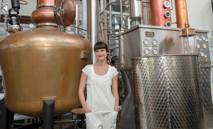 TAPPING THE ENERGY: Manya Rubinstein, CEO of Industrious Spirit Co., a distillery in Providence, says she was drawn to the city and the closeness and collaborative nature among its artisans. / PBN FILE PHOTO/MICHAEL SALERNO