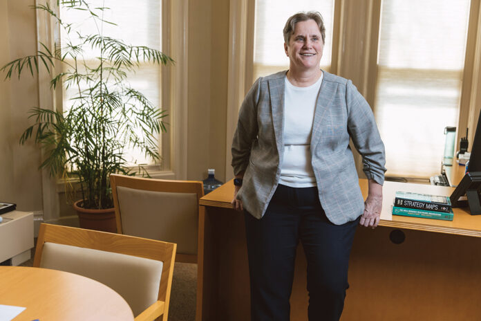 CLIMBING THE LADDER: Mary Marran first began working at Butler Hospital in 1984 as a student. More than three decades later, she rose through the ranks to become just the second female president in the hospital’s history. / PBN PHOTO/RUPERT WHITELEY