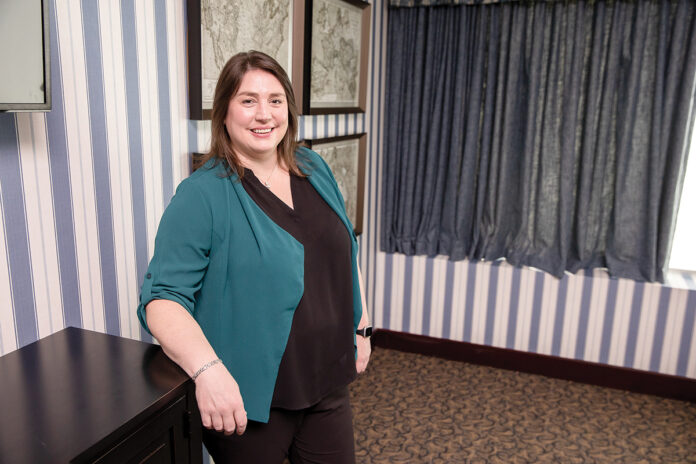 GO-GETTER: Julie Hencler’s willingness to try a variety of positions at Falvey Insurance Group in North Kingstown led to her promotion as corporate controller, where she leads the finance team of accountants and oversees the company’s daily financial operations.  / PBN PHOTO/TRACY JENKINS