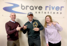 Diverse team at Brave River Solutions positions company for continued success TOP DESIGNERS: Brave River Solutions Inc. President Jim McAssey, left, and Director of Client Services Rebecca Arsenault celebrate their recently earned website design award for Outstanding Achievement in Web Development in the Best Photography Website category from the Web Marketing Association’s annual Web Awards competition with KingBirder.com founder and CEO Tom Younkin. / COURTESY BRAVE RIVER SOLUTIONS INC.