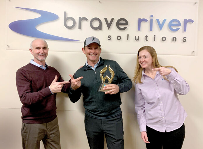 TOP DESIGNERS: Brave River Solutions Inc. President Jim McAssey, left, and Director of Client Services Rebecca Arsenault celebrate their recently earned website design award for Outstanding Achievement in Web Development in the Best Photography Website category from the Web Marketing Association’s annual Web Awards competition with KingBirder.com founder and CEO Tom Younkin. / COURTESY BRAVE RIVER SOLUTIONS INC.