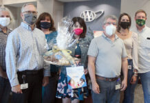 AAA Northeast FRONT-LINE SUPPORT: AAA Northeast staffers assemble and deliver care packages for health care workers last year. / COURTESY AAA NORTHEAST