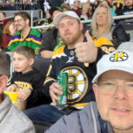 HOCKEY NIGHT: Employees from Connectivity Point Design & Installation LLC take in a Providence Bruins game at the Dunkin’ Donuts Center. / COURTESY CONNECTIVITY POINT DESIGN & INSTALLATION LLC
