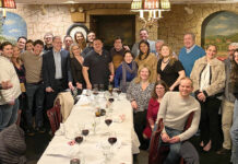 DarrowEverett LLP DINNER TIME: Employees at DarrowEverett LLP gather for a company dinner. / COURTESY DARROWEVERETT LLP