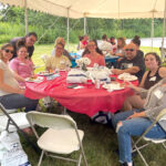 THE GREAT OUTDOORS: Employees from Dominion Diagnostics LLC gather last year for an event celebrating being named to Providence Business News’ Best Places to Work list.  COURTESY DOMINION DIAGNOSTICS LLC