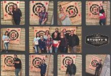 Family-like approach, charity at the core of Embrace Home Loans culture TIGHT-KNIT STAFF: Members of Embrace Home Loans Inc. in Middletown gather for a team-building event at Stumpy’s Hatchet House in Fall River in October 2021. / COURTESY EMBRACE HOME LOANS INC.