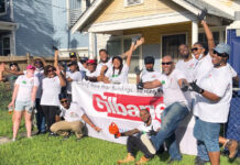 Gilbane Building Co. TEAMWORK: Gilbane Building Co. employees partner with nonprofit Rebuilding Together on a community service project. / COURTESY GILBANE BUILDING CO.