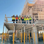 New England Construction Co. ON-THE-JOB TRAINING: New England Construction Co. employees hold a Lunch and Learn Jobsite Tour at a construction site last fall. / COURTESY NEW ENGLAND CONSTRUCTION