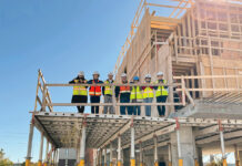 New England Construction Co. ON-THE-JOB TRAINING: New England Construction Co. employees hold a Lunch and Learn Jobsite Tour at a construction site last fall. / COURTESY NEW ENGLAND CONSTRUCTION