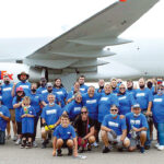 FLYING HIGH: Automated Business Solutions Inc. gather at Rhode Island T.F. Green International Airport in Warwick to participate in a Jet Pull event to support multiple sclerosis awareness.  COURTESY AUTOMATED BUSINESS SOLUTIONS INC.
