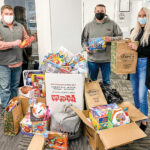 GIFT GIVING: RIKB Design Build team members raise donations for Toys for Tots of Rhode Island during the holiday season. / COURTESY RIKB DESIGN BUILD