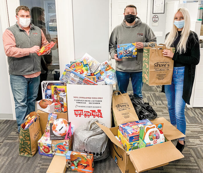 GIFT GIVING: RIKB Design Build team members raise donations for Toys for Tots of Rhode Island during the holiday season. / COURTESY RIKB DESIGN BUILD