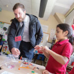 SPARKING IMAGINATION: Rhode Island Foundation Grant Programs Officer Ricky Bogert talks with students at an elementary school in Providence.  COURTESY RHODE ISLAND FOUNDATION