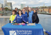 BankNewport SWEET EVENING: BankNewport employees distribute candy as part of a Halloween event on the pedestrian bridge in Providence. / COURTESY BANKNEWPORT