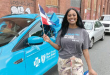 Dedicated employees help Blue Cross weather COVID-19 storm COMMUNITY SUPPORT:
Blue Cross & Blue Shield of Rhode Island Human Resources Business Partner Jess Nunez represents the company at the Dominican Parade of Rhode Island in Providence. / COURTESY BLUE CROSS
& BLUE SHIELD OF
RHODE ISLAND