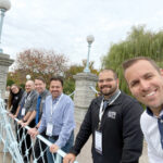 BRIDGE WORK: Members of IT Support RI’s management team gather on a bridge during a recent trip to Boston. / COURTESY IT SUPPORT RI