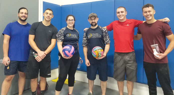 MATCH POINT: DiSanto, Priest & Co. staff members gather to participate in a local volleyball tournament. / COURTESY DISANTO, PRIEST & CO.