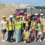 GROUP PROJECT: Picerne Real Estate Group employees gather at a local construction site. / COURTESY PICERNE REAL ESTATE GROUP