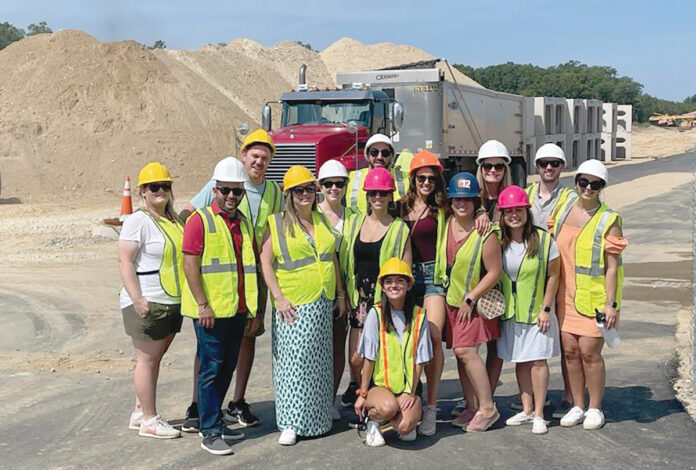 GROUP PROJECT: Picerne Real Estate Group employees gather at a local construction site. / COURTESY PICERNE REAL ESTATE GROUP GROUP PROJECT: Picerne Real Estate Group employees gather at a local construction site. / COURTESY PICERNE REAL ESTATE GROUP