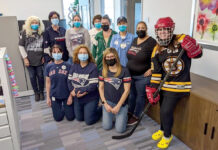University Orthopedics Inc. GAME ON: Employees with University Orthopedics Inc. dress up in their favorite sports attire in the office. / COURTESY UNIVERSITY ORTHOPEDICS INC.