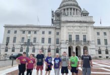 Navigant Credit Union PACESETTERS: Staffers from Navigant Credit Union pose in front of the R.I. Statehouse before participating in the annual Providence Downtown 5K. / COURTESY NAVIGANT CREDIT UNION