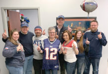 Secure Future Tech Solutions PATRIOTS PRIDE: Employees at Secure Future Tech Solutions wear New England Patriots attire as part of the company’s Patriots Spirit Day.
COURTESY SECURE FUTURE TECH SOLUTIONS