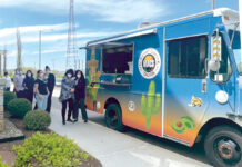 Tockwotton on the Waterfront TACO TIME: Tockwotton on the Waterfront employees get in line for tacos from a Street Corn Taco food truck. / COURTESY TOCKWOTTON ON THE WATERFRONT