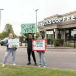 STRONG SUPPORTERS: Autumn Guillotte, left, organizer at the Rhode Island AFL-CIO; David Molina-Hernandez, organizer at Fueza El Laboral; and Kristy Eiland, volunteer, show their support for Starbucks Corp. employees at a Warwick store off Route 2 to form a union prior to the employees’ vote in early June. PBN PHOTO/TRACY JENKINS 