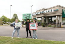 STRONG SUPPORTERS: Autumn Guillotte, left, organizer at the Rhode Island AFL-CIO; David Molina-Hernandez, organizer at Fueza El Laboral; and Kristy Eiland, volunteer, show their support for Starbucks Corp. employees at a Warwick store off Route 2 to form a union prior to the employees’ vote in early June. PBN PHOTO/TRACY JENKINS 
