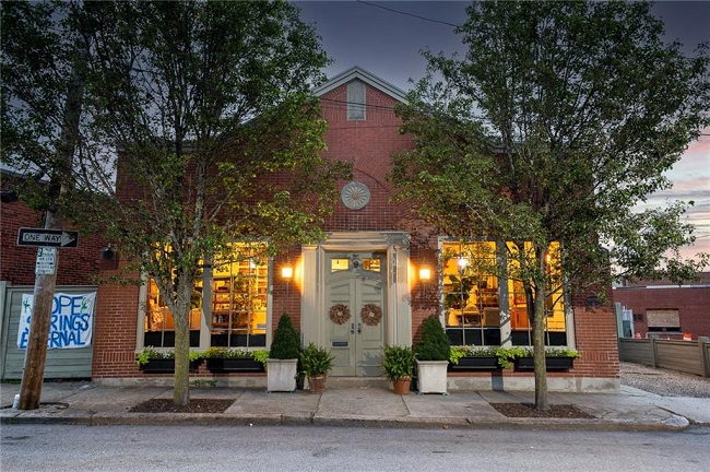 A SYMBOL OF PAWTUCKET’S ARTISTIC REVIVAL, the two-story, brick, single-family home at 9 Montgomery St., was sold recently for $890,000. / COURTESY RESIDENTIAL PROPERTIES LTD.