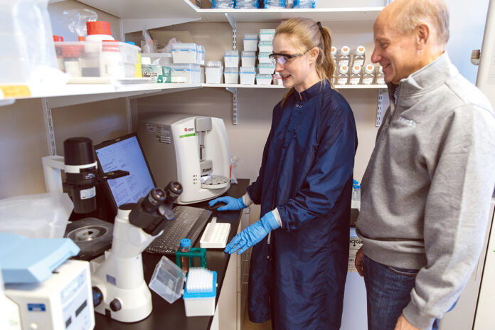 BUSINESS ­TRIALS: Cumberland-based Neurotech Pharmaceuticals Inc. has been among the companies dealing with supply chain and hiring challenges. Pictured above are CEO Richard Small and process development engineer Lovisa Selander.  PBN FILE PHOTO/­RUPERT WHITELEY