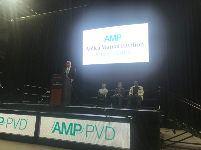 DANIEL P. MCCONAGHY, R.I. Convention Center Authority executive director, left, addresses the crowd Wednesday inside the newly named Amica Mutual Pavilion in Providence. Also pictured, from left, are Providence Mayor Jorge O. Elorza, new Providence Bruins Head Coach Ryan Mougenel and Providence College Men’s Basketball Head Coach Ed Cooley. / PBN PHOTO/JAMES BESSETTE