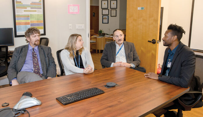 HEALTHY CONVERSATION: From left, Dr. Michael Coburn, medical director; Chief Operating Officer Sarah Horgan; Fred A. Trapassi Jr., CEO; and Courtney Stafford, director, clinical process improvement, at AdCare Rhode Island Inc. meet at the organization’s North Kingstown office.
PBN PHOTO/TRACY JENKINS HEALTHY CONVERSATION: From left, Dr. Michael Coburn, medical director; Chief Operating Officer Sarah Horgan; Fred A. Trapassi Jr., CEO; and Courtney Stafford, director, clinical process improvement, at AdCare Rhode Island Inc. meet at the organization’s North Kingstown office.
PBN PHOTO/TRACY JENKINS
