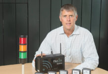 A PERFECT LINK: FlorLink Inc. CEO Mark Barnes poses with the company’s SmartHub system, a platform that collects, connects and routes live data and information.  PBN PHOTO/DAVID HANSEN