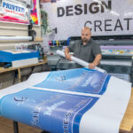 FULFILLING WORK: Justin Gontarek, owner of Simplicity Print Studio in Warwick, says running his own screen printing and embroidery business may not be as profitable as the work he did previously with larger corporations but it’s more rewarding. PBN PHOTO/MICHAEL SALERNO