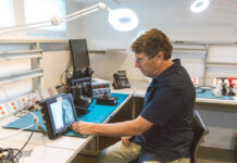 A CLEAR PICTURE: Joe Janson, CEO and president of NVTS Night Vision Technology Solutions Inc., views an image produced by a thermal camera at his North Kingstown office.  PBN PHOTO/RUPERT WHITELEY