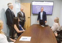 ROUNDTABLE DISCUSSION: Pictured from left are Lathrop Insurance Agency Inc. account executives Pam Gersbeck and Elena Ivanez-Vilaplana; Vice Presidents David Anderson and James Kane; President Dan Lathrop; and commercial account executive Gina Arnold at the company’s Westerly office. PBN PHOTO/RUPERT WHITELEY