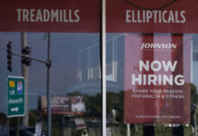 Fewer Americans seek jobless benefits despite slowing economy A HELP WANTED sign is displayed in a Northbrook, Ill., storefront. The number of Americans applying for unemployment benefits fell last week and remains historically low even as the U.S. economy slows in the midst of decades-high inflation. / AP PHOTO/NAM Y. HUH