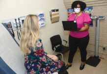 Mental health providers are overwhelmed in R.I. VITAL SERVICE: Ashlee Austin, right, site inclusive health clinician at Thundermist Health Center, meets with a patient at the
center’s West Warwick location.
PBN PHOTO/ELIZABETH GRAHAM