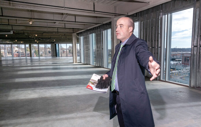 BROWN UNIVERSITY on Thursday announced it had signed a 10-year lease with the owners of the Wexford Science & Technology building to use one of the empty, upper floors as a research and wet lab space. Pictured is Andrew Galvin, with CBRE commercial realtors, who helped market the empty floors to potential life science companies. / PBN FILE PHOTO/MICHAEL SALERNO