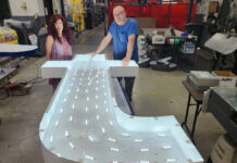 Poyant thrives by employing old family values and new efficiency methods ON TARGET: Natalia Pelletier, Poyant Signs Inc.’s senior project manager, and Bill Furey, the company’s channel letter production lead, stand over a sign made for Target.
COURTESY POYANT SIGNS INC.