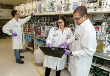 LAB WORK: From left, Amgen Rhode Island scientists George Boras, Natalie Kieon and Bishouy Sharoubim join together in a laboratory inside the West Greenwich manufacturing facility.  PBN PHOTO/TRACY JENKINS