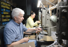 Small size, low overhead allows Snow Findings to nimbly navigate industry shakeups STAMP OF APPROVAL: Snow Findings Co. President Bob Snow and employee Maria Pena work on the metal stamping service company’s manufacturing floor
in West Warwick.
PBN PHOTO/
ELIZABETH GRAHAM