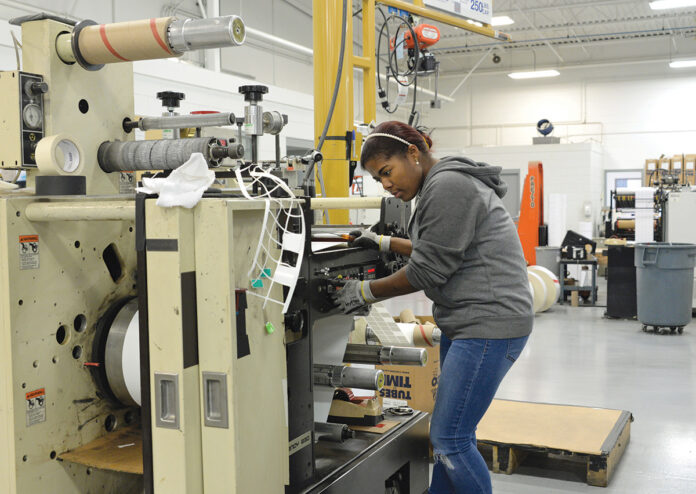 ENHANCED OPERATION: Keila Mendez, a machine operator at AstroNova Inc., works at the company’s West Warwick facility. The company, which designs, manufactures, distributes and services data visualization technologies, hired a new director of quality and continuous improvement and implemented new safety measures that have contributed to improved operations.
PBN PHOTO/ELIZABETH GRAHAM ENHANCED OPERATION: Keila Mendez, a machine operator at AstroNova Inc., works at the company’s West Warwick facility. The company, which designs, manufactures, distributes and services data visualization technologies, hired a new director of quality and continuous improvement and implemented new safety measures that have contributed to improved operations.
PBN PHOTO/ELIZABETH GRAHAM