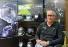 Whether for industrial or health care needs, Optrel is all about protecting people INNOVATION LEADER: Grant Cooper, CEO of Optrel Inc. in East Greenwich, says the manufacturer primarily focused on industrial protection, such as the welder helmets seen behind him, before the COVID-19 pandemic. Now Optrel has transitioned into products that are more health care friendly.
PBN PHOTO/ELIZABETH GRAHAM
